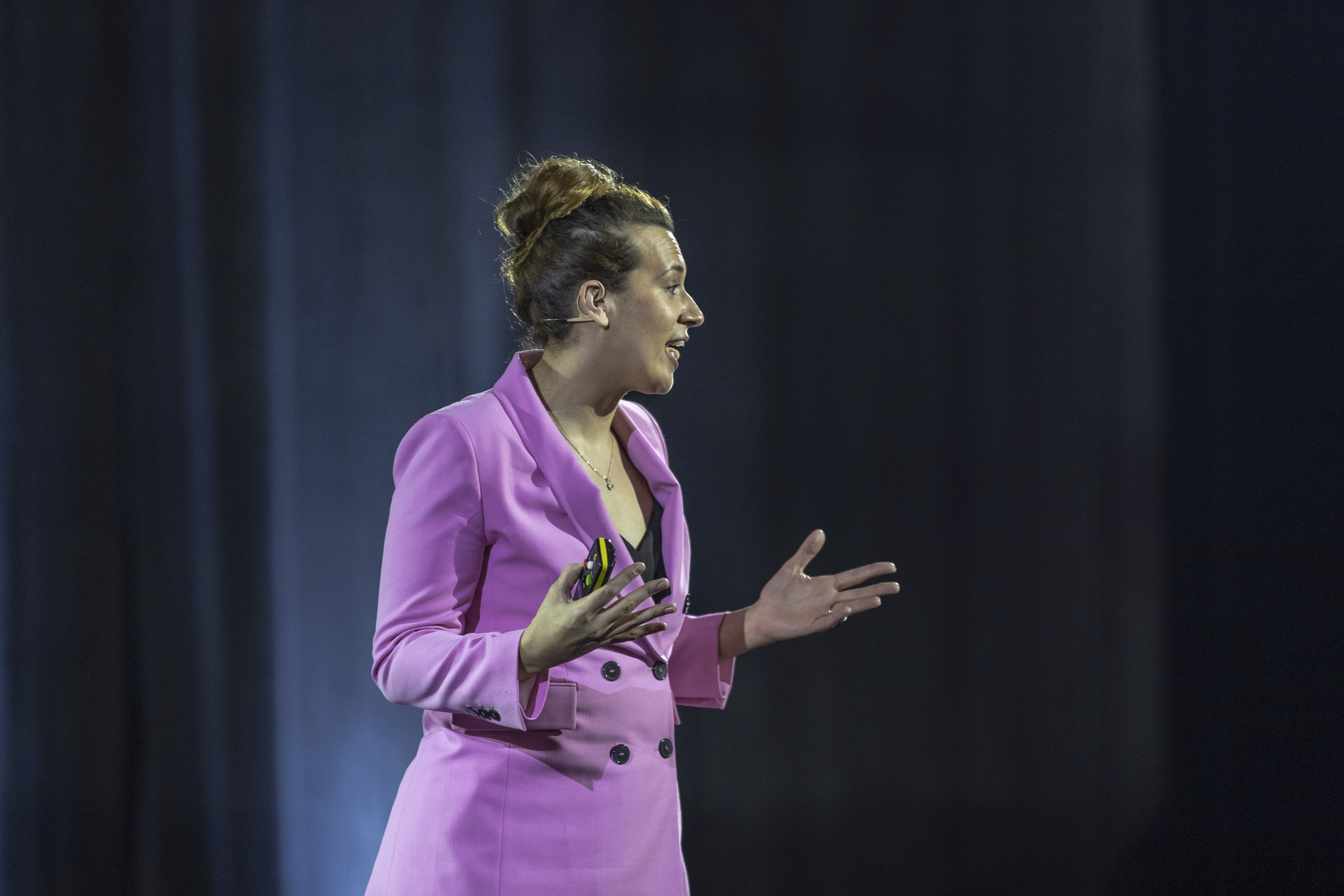 Businesswoman presenting at a conference.