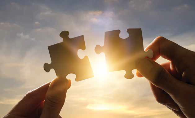 fitting two puzzle pieces together