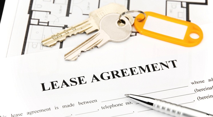 keys on top of a lease agreement
