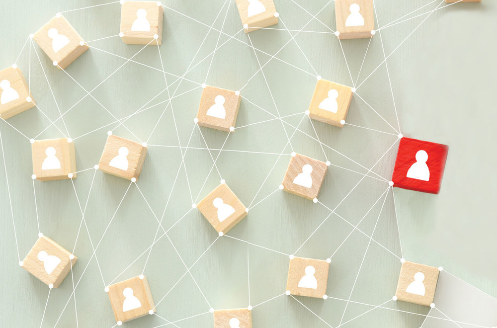 Multiple wooden blocks connected to each other. one is red.