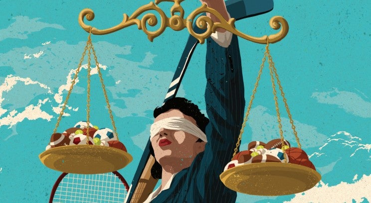 Justice figure holding scales with sports balls on them