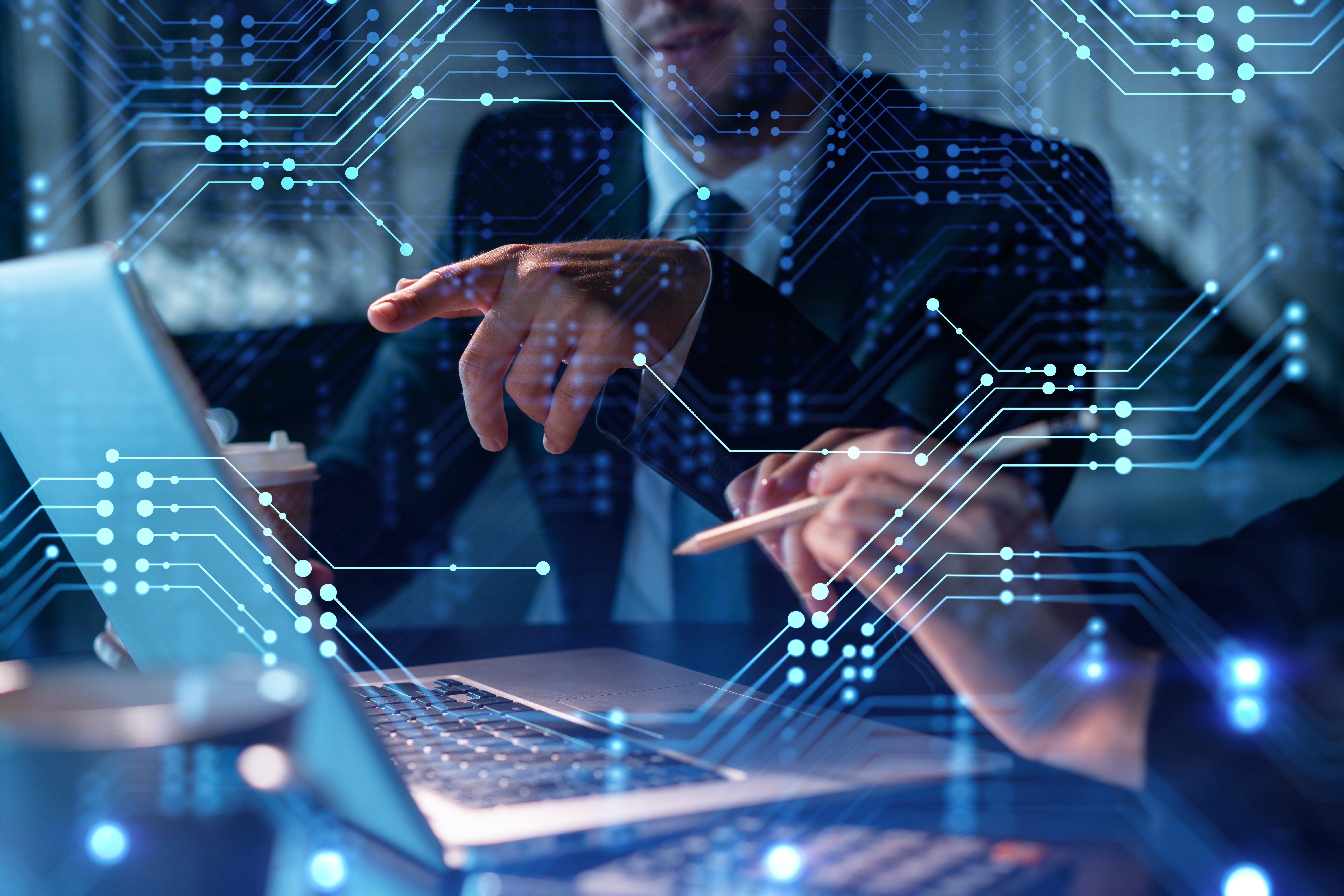 Man and woman applying new technologies. Holograms displayed over computer. 