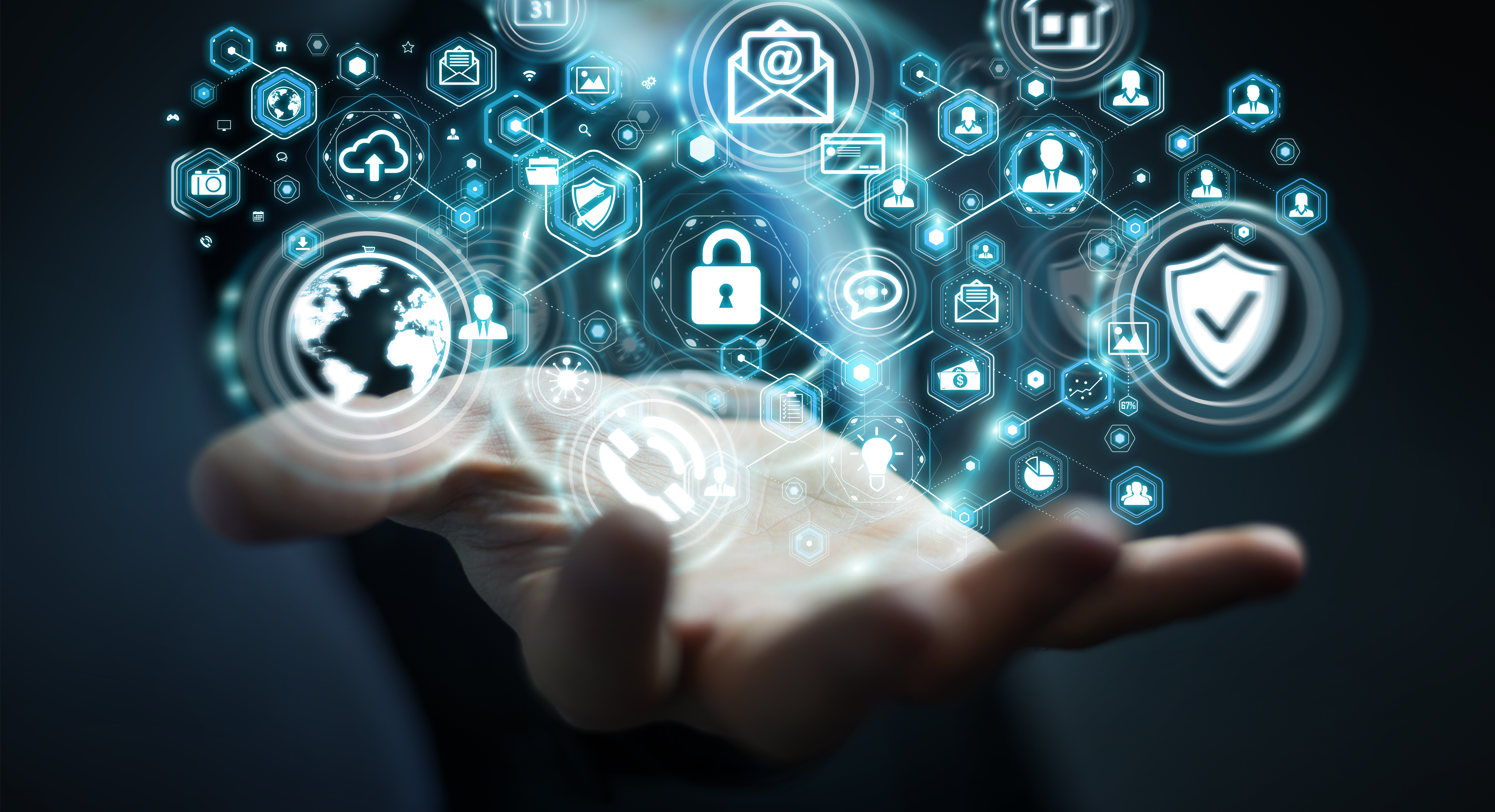 A hand holding icons of personal data such as email, finances and images.