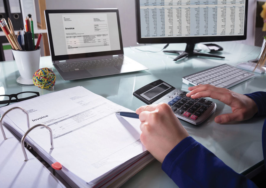 A person working on an invoice