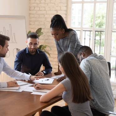 Volunteer workers around a table