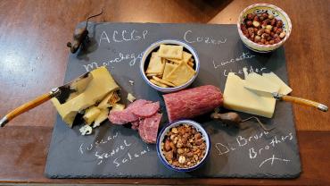 Gourmet charcuterie on a slate plate.