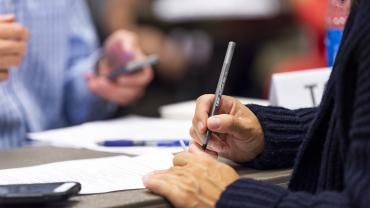 Woman signing document