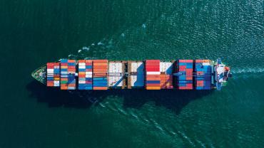 a boat holding shipping containers