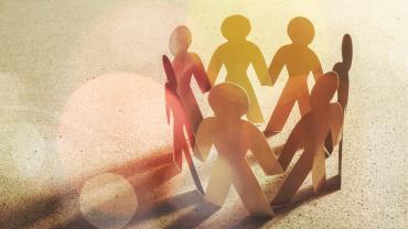 Paper people in a circle