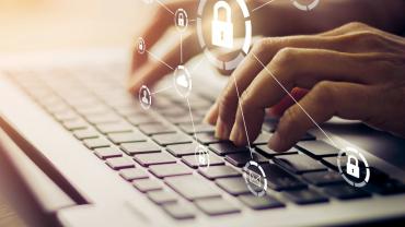 finger typing on a computer keyboard. lock symbols are shown