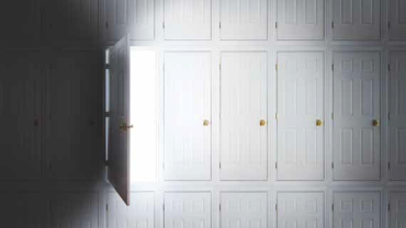 one open door surrounded by many closed doors