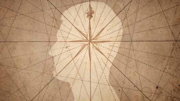 a compass rose and  human silouhette