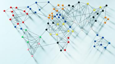 a map of the world made of push pins and string