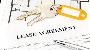 keys on top of a lease agreement