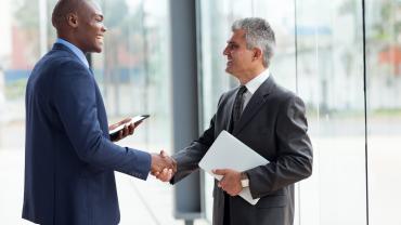 Two businesspeople shaking hands