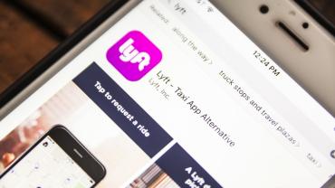 photo of car sharing app Lyft on a cell phone screen
