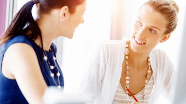 two women collaborating together