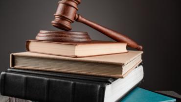 gavel sitting on stack of books