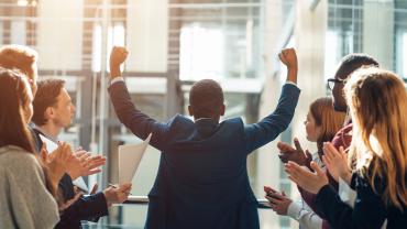 Colleagues celebrating team member