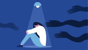 Scared woman in a dark room sitting under a lamp with shadowy hands reaching towards her. 