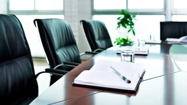 Notepad on conference room table. 