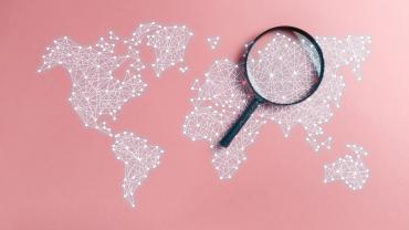 magnifying glass on world map