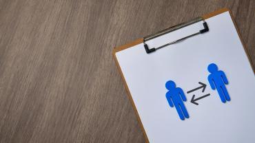 clipboard with arrows between two figures