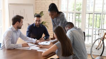 Volunteer workers around a table
