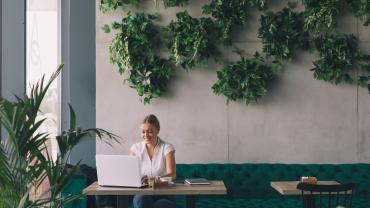 Woman working in trendy coffee shop