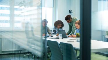 Office workers deliberating