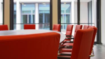 empty conference room table and chairs