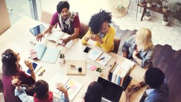 a diverse group of business people around a table