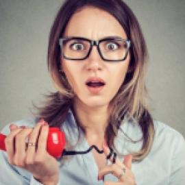 Surprised woman holding a phone