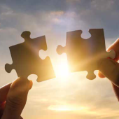 fitting two puzzle pieces together