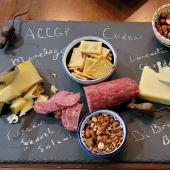 Gourmet charcuterie on a slate plate.