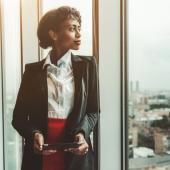 Business woman looking out a window