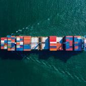 a boat holding shipping containers