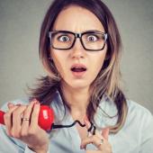 Surprised woman holding a phone