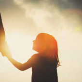 a child holding a hand