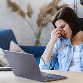 a stressed woman working from home 