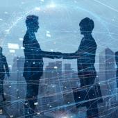 silhouettes shaking hands