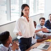 Business woman addressing boardroom