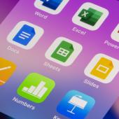 Screen of iPhone with Office Suite apps and purple background.