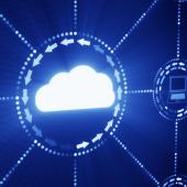 Glowing white cloud surrounded by white network connecting it to digital icons in front of a dark blue background.