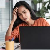 Stressed woman on video call