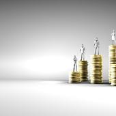 piles of gold with figurines on top looks like different genders