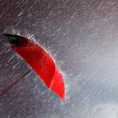umbrella, red, up leaning toward sideways rain