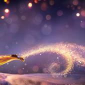 genie lamp with light spray coming out of it like genie is inside coming out