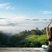 Young woman practicing yoga in nature. 