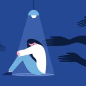 Scared woman in a dark room sitting under a lamp with shadowy hands reaching towards her. 